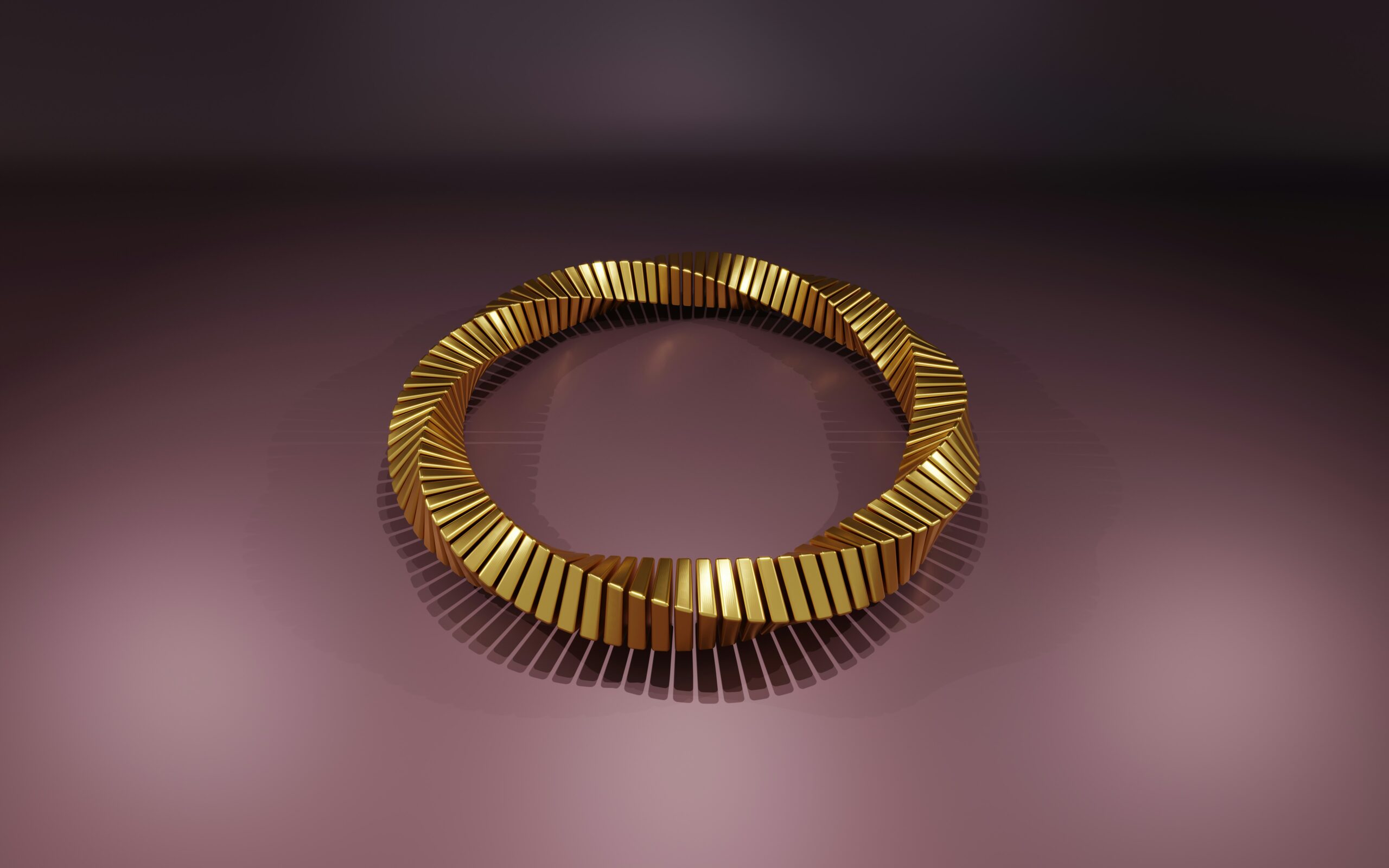 a gold bracelet on a purple background